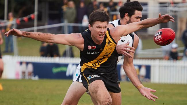 Glenelg's Ziggy Vitkunas gets pushed by South's Adam Gulden. Picture: MATT LOXTON