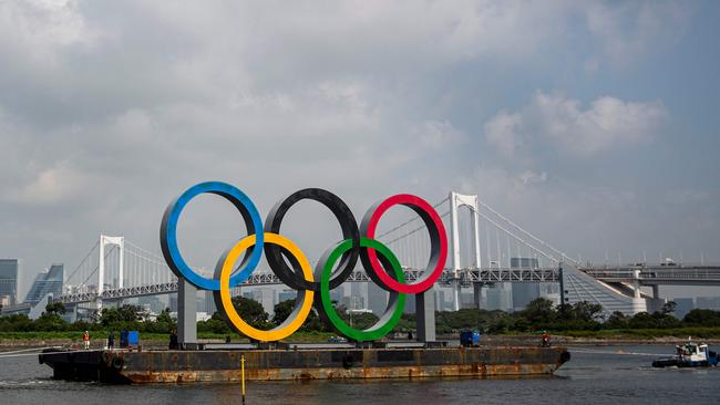 The Olympic rings in front of Rainbow Bridge at Tokyo Waterfront in the waters of Odaiba Marine Park. Picture: AFP.