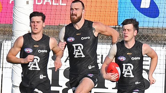 Port Adelaide's Connor Rozee, Charlie Dixon and Zak Butters training at Alberton Oval. Picture: Tom Huntley