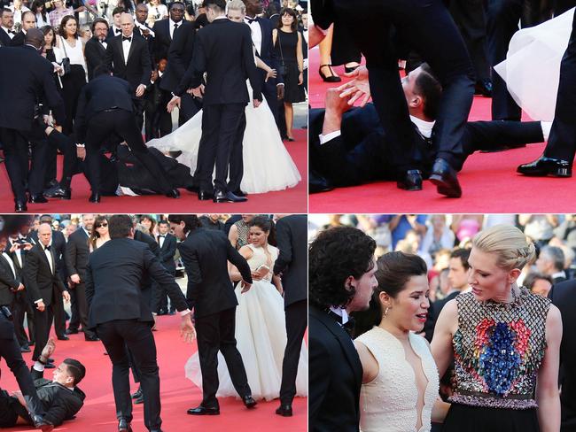 Prankster Vitalii Sediuk was restrained as he tried to slip under America Ferrera's dress.
