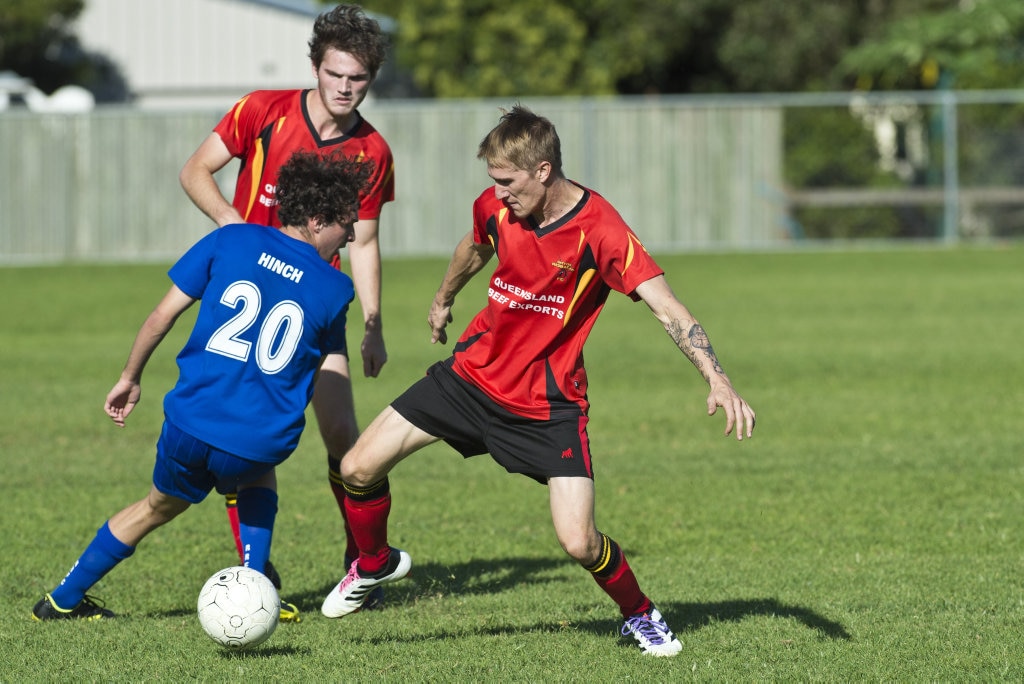 Rockville player Braiden Hinch (left) battles with Brendan Newby (right) of Gatton in Toowoomba Football League Premier Men round six at Captain Cook ovals, Sunday, April 7, 2019. Picture: Kevin Farmer