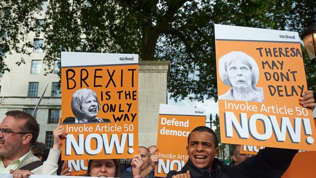 Pro-Brexit supporters holds up placards as they demonstrate outside Downing street in central London on July 13, 2016, on the day new British Prime Minister Theresa May took over at number 10. Pro-Brexit Britons were often demonised in the lead-up to the historic vote. Picture: Niklas Hallen