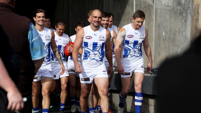 Ben Cunnington leads the Kangaroos onto Adelaide Oval. Picture: James Elsby/AFL Photos