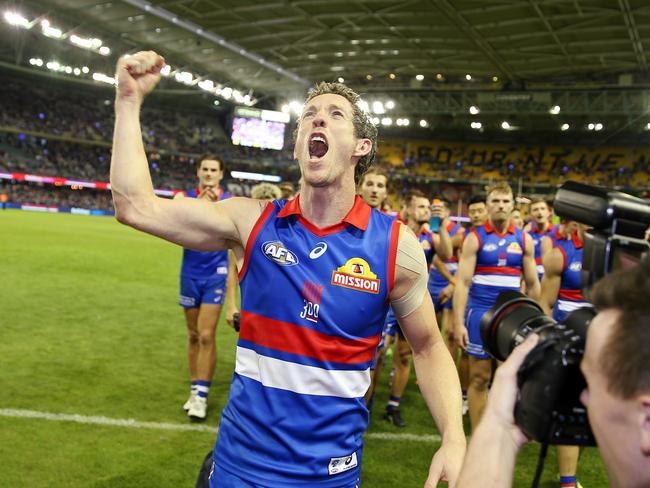 Murphy screams with joy as he walks off the ground after a win in his 300th game. Picture: Michael Klein