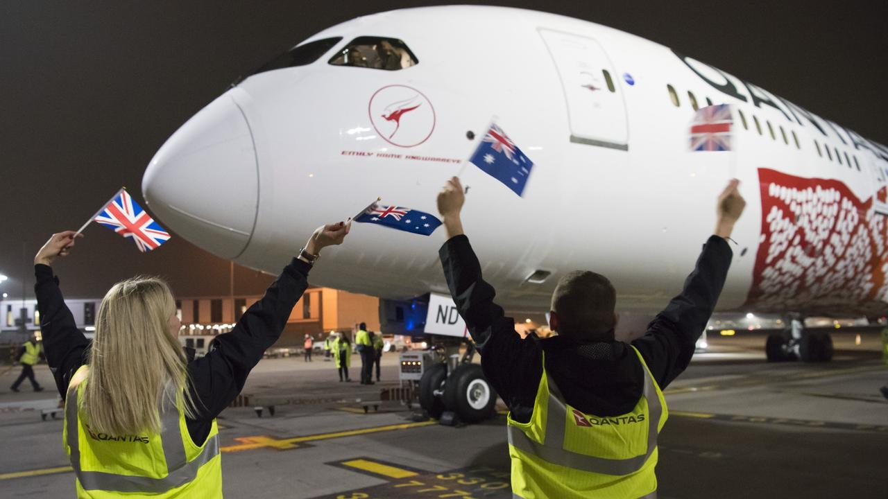 A Qantas Dreamliner makes history as it lands at Heathrow Airport after the first direct flight between Australia and the UK.