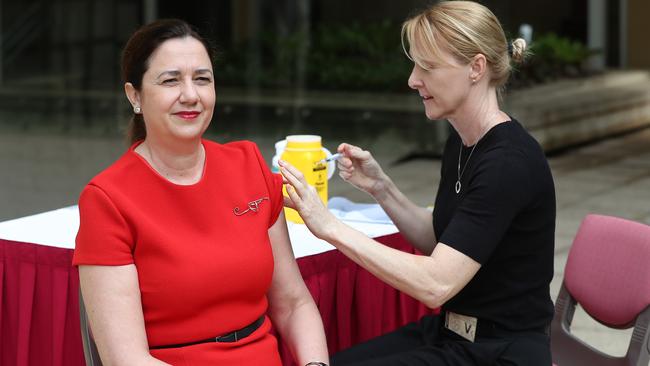 Queensland Premier Anastasia Palaszczuk, pictured getting a flu vaccination, says she will clam down if rules easing is not followed responsibly. Picture: Peter Wallis