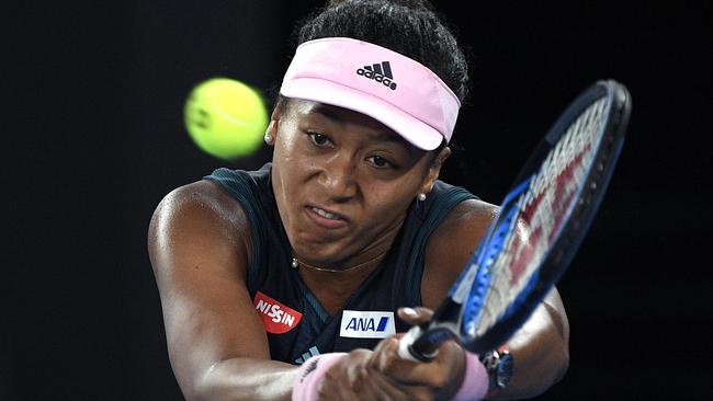 Naomi Osaka unleashes a booming backhand return to Karolina Pliskova. Picture: Andy Brownbill/AP