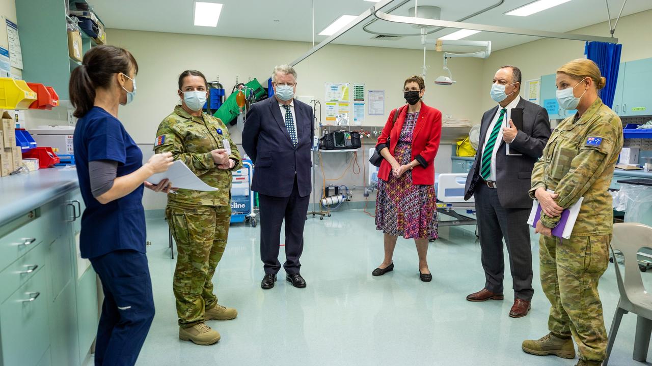 Royal Commissioners' Mr Nick Kaldas (centre right), Dr Peggy Brown (centre) and the Honourable James Douglas, QC, learn about the role of Lavarack Health Centre during their visit to the 3rd Brigade at Lavarack Barracks. Picture: Brodie Cross