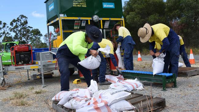 Gold Coast City workers prepare sandbags for residents. (Photo/Steve Holland)