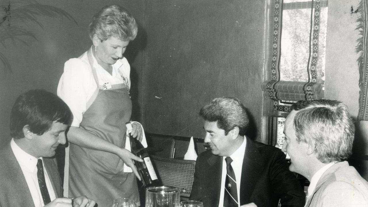 A waitress serves wine to a party of dinners in 1984. Photo: David Hele/ The Advertiser.