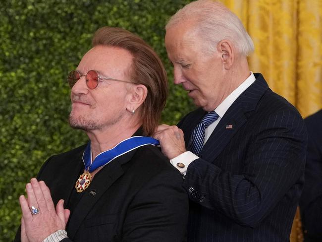 Rock star Bono receives the Medal of Freedom from US President Joe Biden during a ceremony at the White House in Washington, DC, January 4. Picture: Chris Kleponis / AFP