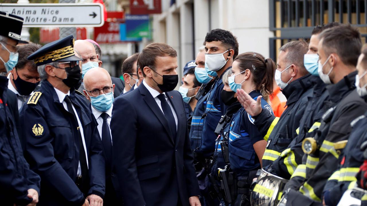 The French President visits the scene. Picture: AFP