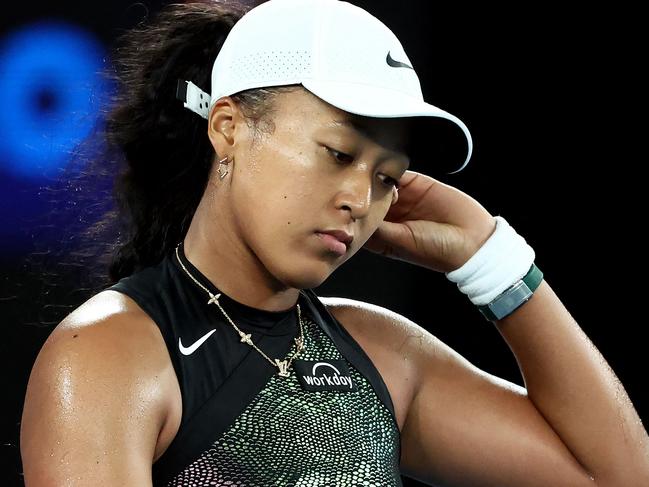 Japan's Naomi Osaka reacts after losing against France's Caroline Garcia during their women's singles match on day two of the Australian Open tennis tournament in Melbourne on January 15, 2024. (Photo by David GRAY / AFP) / -- IMAGE RESTRICTED TO EDITORIAL USE - STRICTLY NO COMMERCIAL USE --