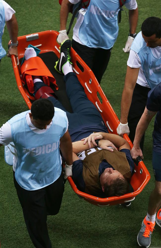 England physio Gary Lewin is stretchered off the field after dislocating his ankle during the 2014 FIFA World Cup Group D match between England and Italy.