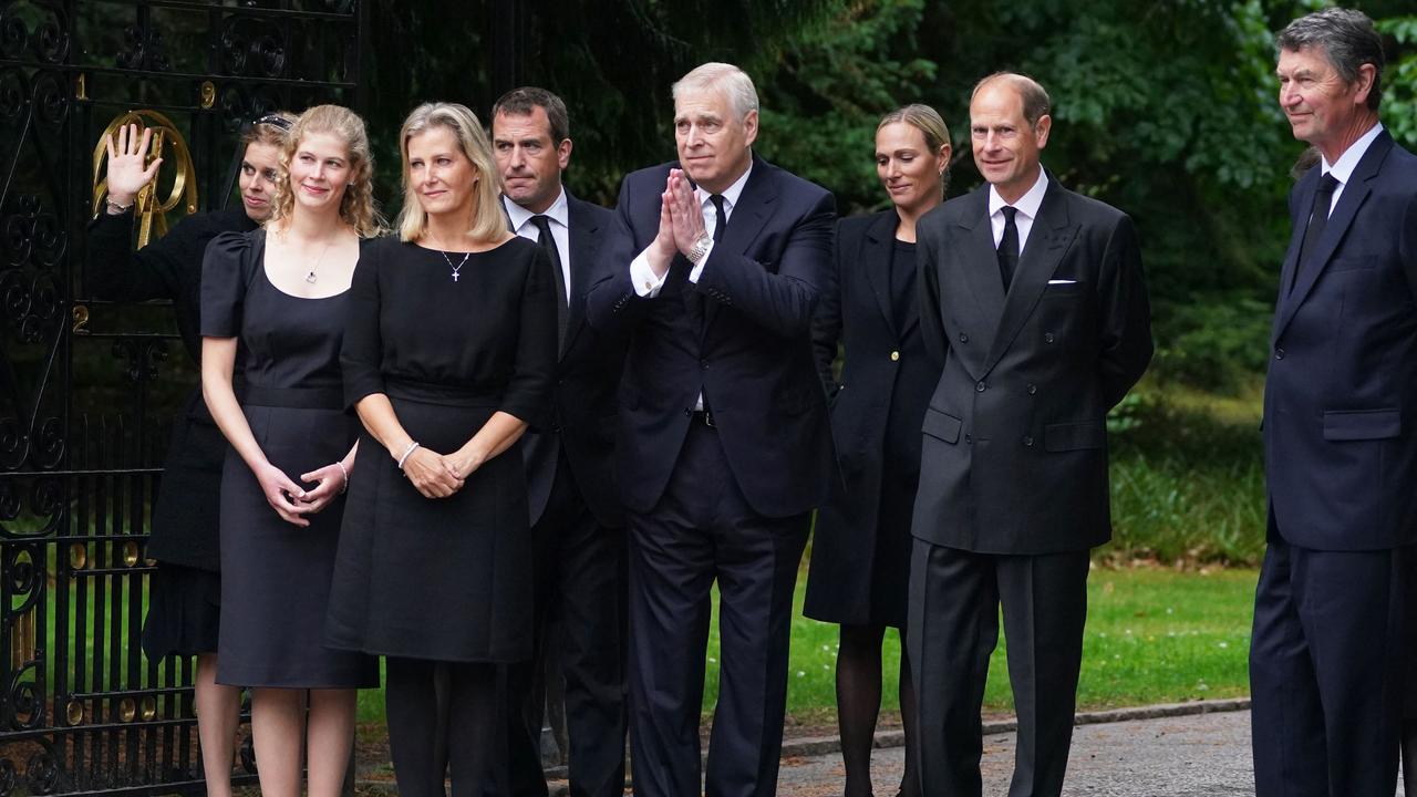 Britain's Princess Beatrice of York, Britain's Lady Louise Windsor, Britain's Sophie, Countess of Wessex, Peter Phillips, Britain's Princess Eugenie of York (obscured), Britain's Prince Andrew, Duke of York, Zara Phillips and Britain's Prince Edward, Earl of Wessex greet members of the public gathered outside of Balmoral Castle in Ballater. Picture: AFP