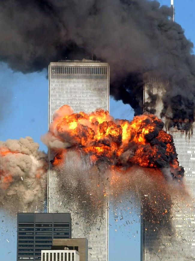 Hijacked airliners crash into the twin towers.