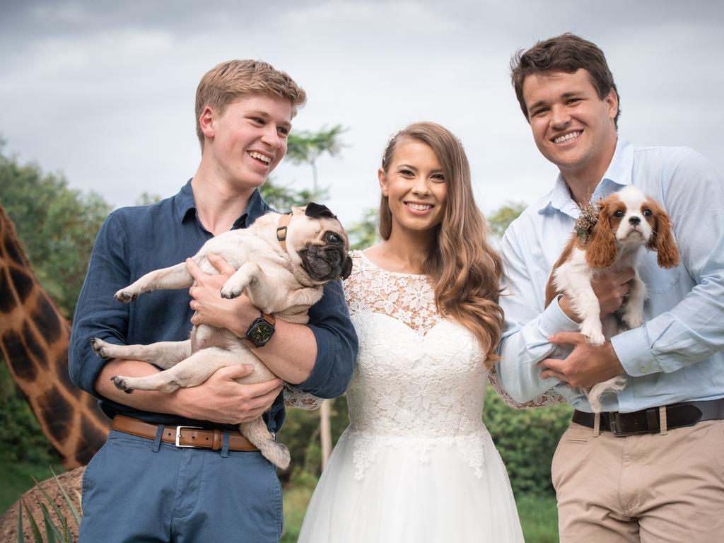 Chandler Powell and Bindi Irwin and Robert Iwin. Chandler is holding “Piggy” and Robert is holding “Stella”. Picture: Kate Berry