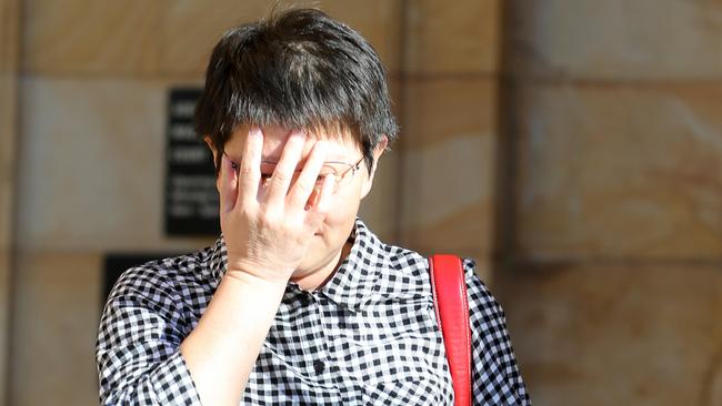 Chunping Quan leaves the Magistrates Court in Adelaide on Tuesday, March 27. Picture: AAP Image/Kelly Barnes