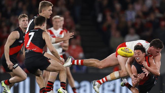 Jye Caldwell of the Bombers handballs under heavy pressure. Picture: Getty Images