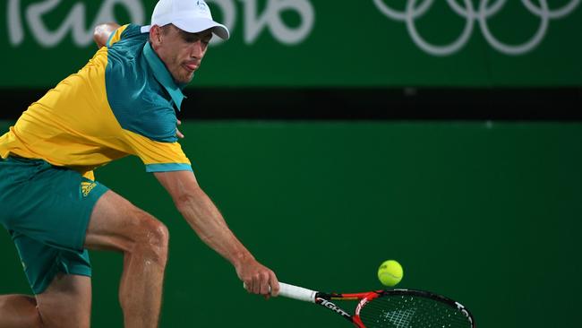 Australia's John Millman returns the ball to Japan's Kei Nishikori during their men's second round singles tennis match at the Olympic Tennis Centre of the Rio 2016 Olympic Games in Rio de Janeiro on August 8, 2016. / AFP PHOTO / Roberto SCHMIDT