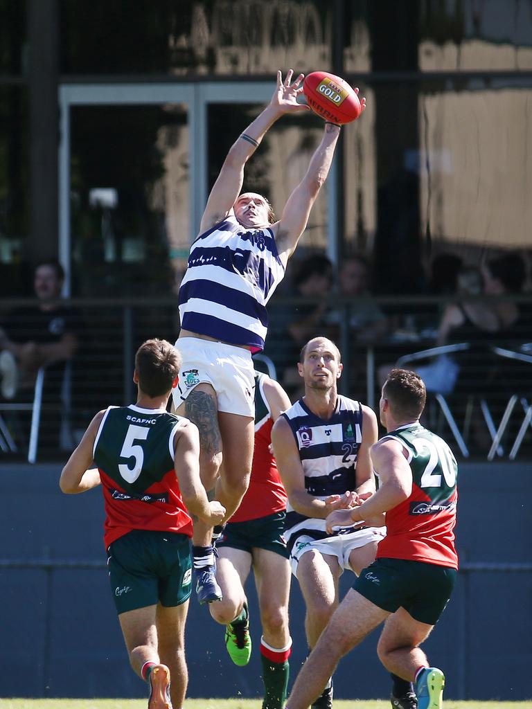 Crocs' Zach Beckman soars high to take a mark in the AFL Cairns Premiership men's match between the South Cairns Cutters and the Port Douglas Crocs, held at Fretwell Park, Bentley Park. Picture: Brendan Radke