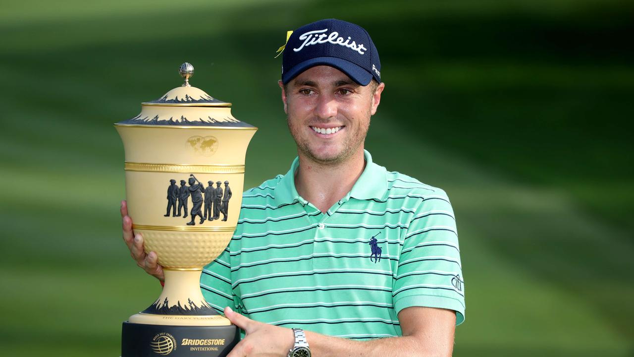 Justin Thomas poses with the Gary Player Cup.