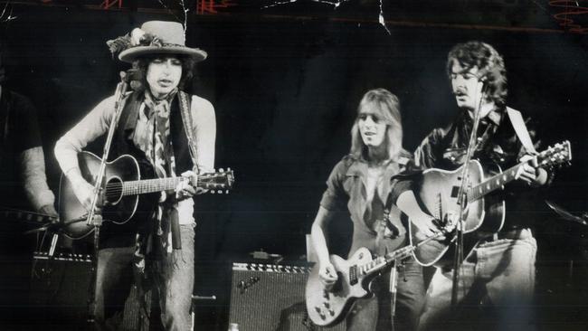 His rolling thunder revue making its way toward New York - Bob Dylan with folk music personalities Mick Ronson and Bobby Neuwirth in 1975. Picture: Getty Images