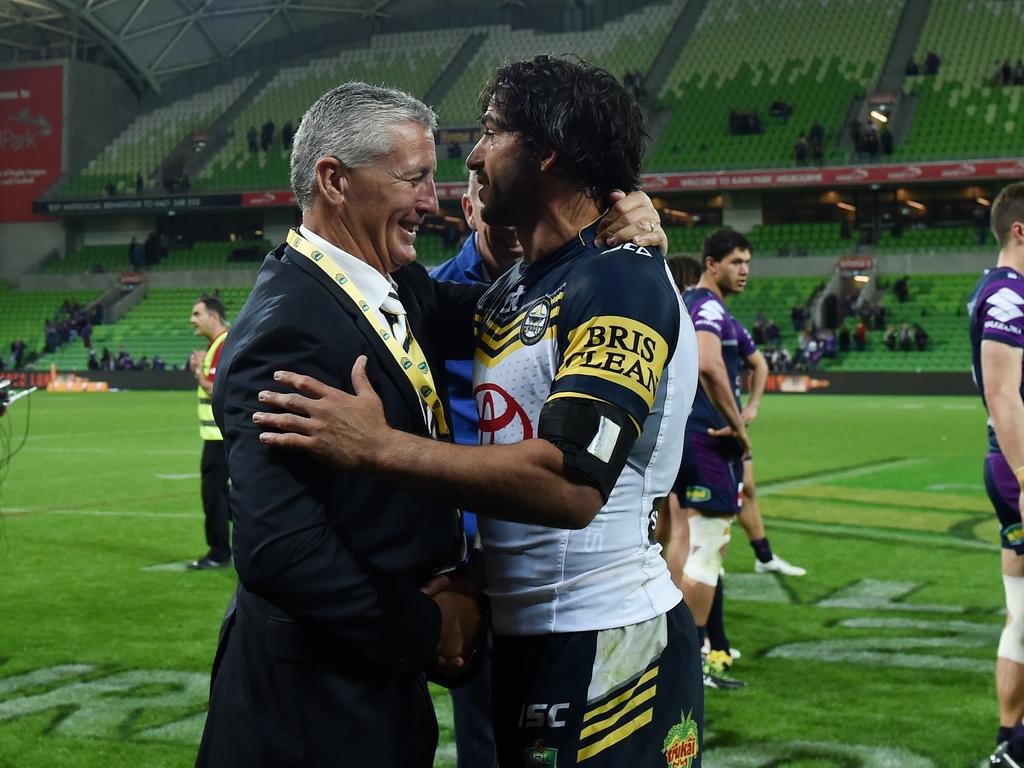 Cowboys halfback Johnathan Thurston is hugged by Cowboys coach Paul Green after winning the NRL 2nd preliminary finals, between the Melbourne Storm and the North Queensland Cowboys, played at AAMI Park in Melbourne, Saturday, Sept. 26, 2015. (AAP Image/Tracey Nearmy) NO ARCHIVING EDITORIAL USE ONLY