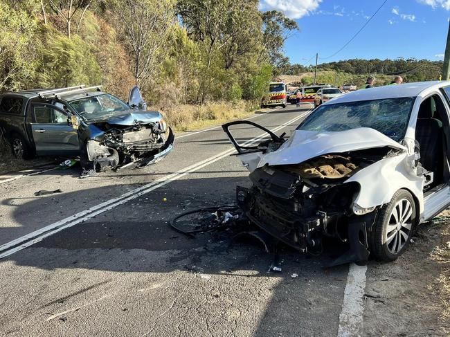 A head-on crash between a ute and hatchback on the two-lane Mona Vale Rd (West) at Ingleside in August 2023. The smash left three people, including an elderly couple, injured. Picture: Terrey Hills Rural Fire Service