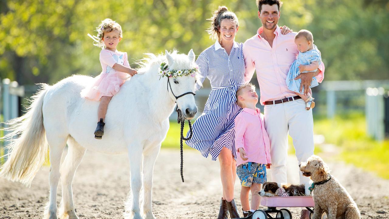 Cassie and Rob Palm and kids Harry, 5, Poppy, 3, and Florence, 7 months, are geared up for Flemington’s Fashions on your Front Lawn. Picture: Mark Stewart