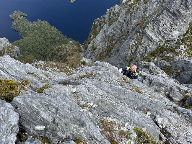 Senior Constable Callum Herbert from Police Search and Rescue on the summit climb to Federation Peak during a recent mission.