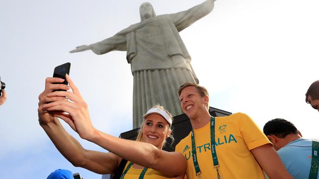 Australian swimmers Taylor McKeown and Travis Mahoney take time out to visit the Christ Redeemer. Pic: Adam Head