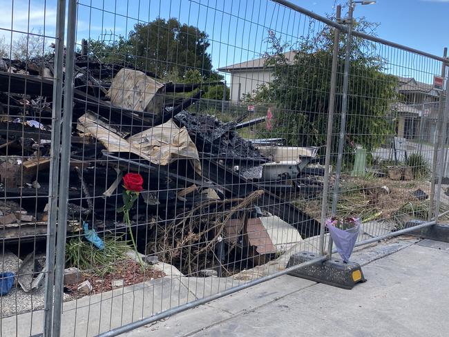 Floral tributes left at the scene of a double fatal townhouse blaze at Browns Plains in Logan. Picture: Nilsson Jones