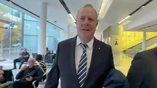 Peter Costello allegedly pushes reporter Liam Mendes to the ground at Canberra airport. Picture: The Australian