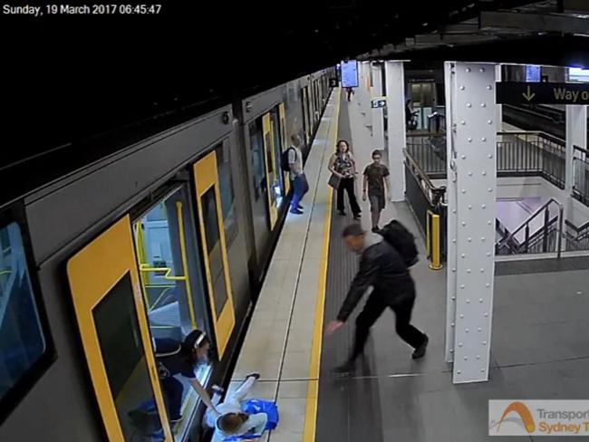 A man rushes to help the girl. Picture: Sydney Trains