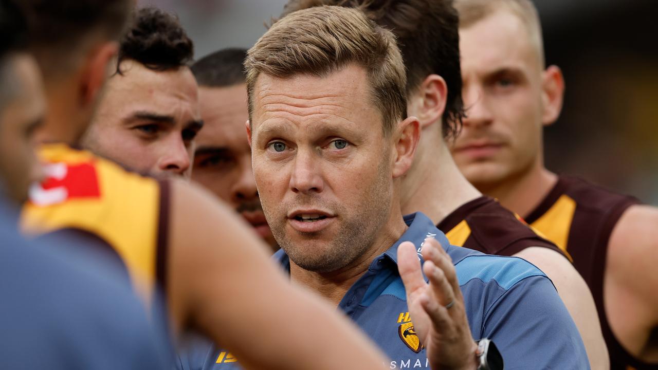 MELBOURNE, AUSTRALIA - MARCH 19: Sam Mitchell, Senior Coach of the Hawks addresses his players during the 2023 AFL Round 01 match between the Hawthorn Hawks and the Essendon Bombers at the Melbourne Cricket Ground on March 19, 2023 in Melbourne, Australia. (Photo by Dylan Burns/AFL Photos via Getty Images)