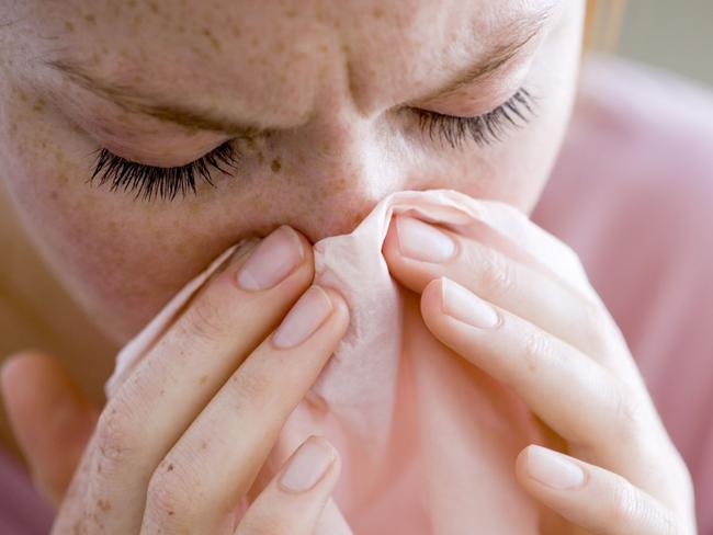 Woman blowing nose for Suns sickie thing