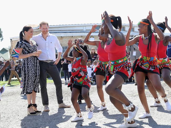 Meghan wore a casual midi-dress and espadrilles to visit a Justice Desk initiative in Nyanga township, during their royal tour of South Africa. Photo: Chris Jackson