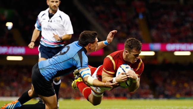 Gareth Davies of Wales scores his team’s sixth try at the Millennium Stadium.