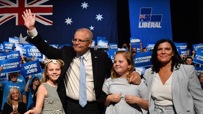 Prime Minister Scott Morrison with daughters Abbey (L), Lily and wife Jenny after a campaign rally at Sydney Olympic Park in Sydney. Picture: AAP 