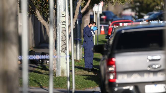 Police and forensics gathering evidence on scene in Malone St in Geelong, the scene of a brutal murder last Friday. Picture: David Smith.