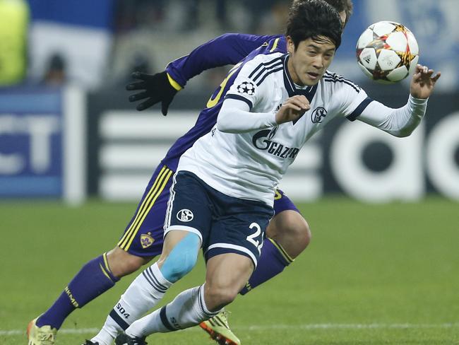 Schalke's Atsuto Uchida goes for the ball during the Champions League group G soccer match between Maribor and Schalke 04, at Ljudski Vrt stadium, in Maribor, Slovenia, Wednesday, Dec. 10, 2014.(AP Photo/Darko Bandic)