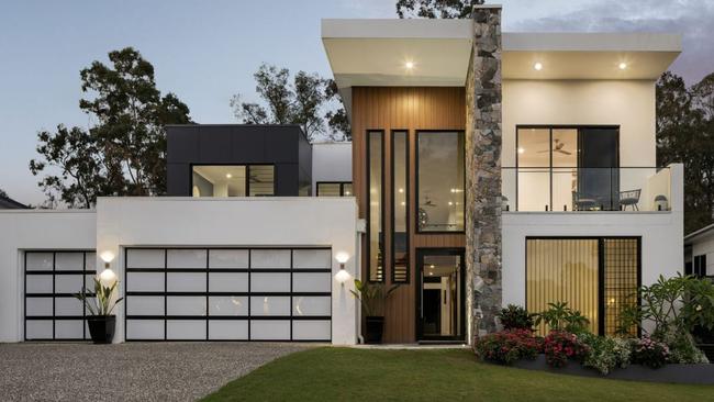 The house has a striking visual design and private access to the nearby golf club.