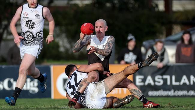 Zach Callinan of Ringwood feeds a handball out earlier this finals series. Picture: George Salpigtidis