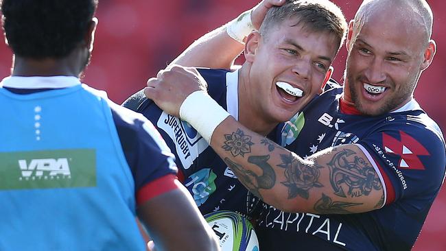 NEWCASTLE, AUSTRALIA - SEPTEMBER 05: Tom Pincus of the Rebels   celebrates with Bill Meakes of the Rebels after scoring a try during the round 10 Super Rugby AU match between the Melbourne Rebels and the Western Force at McDonald Jones Stadium on September 05, 2020 in Newcastle, Australia. (Photo by Jason McCawley/Getty Images)