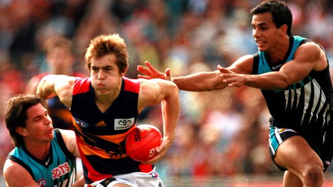 A young Richard Douglas battles Port Adelaide’s Adam Kingsley and Danyle Pearce during his debut season in 2006. Picture: Matt Turner