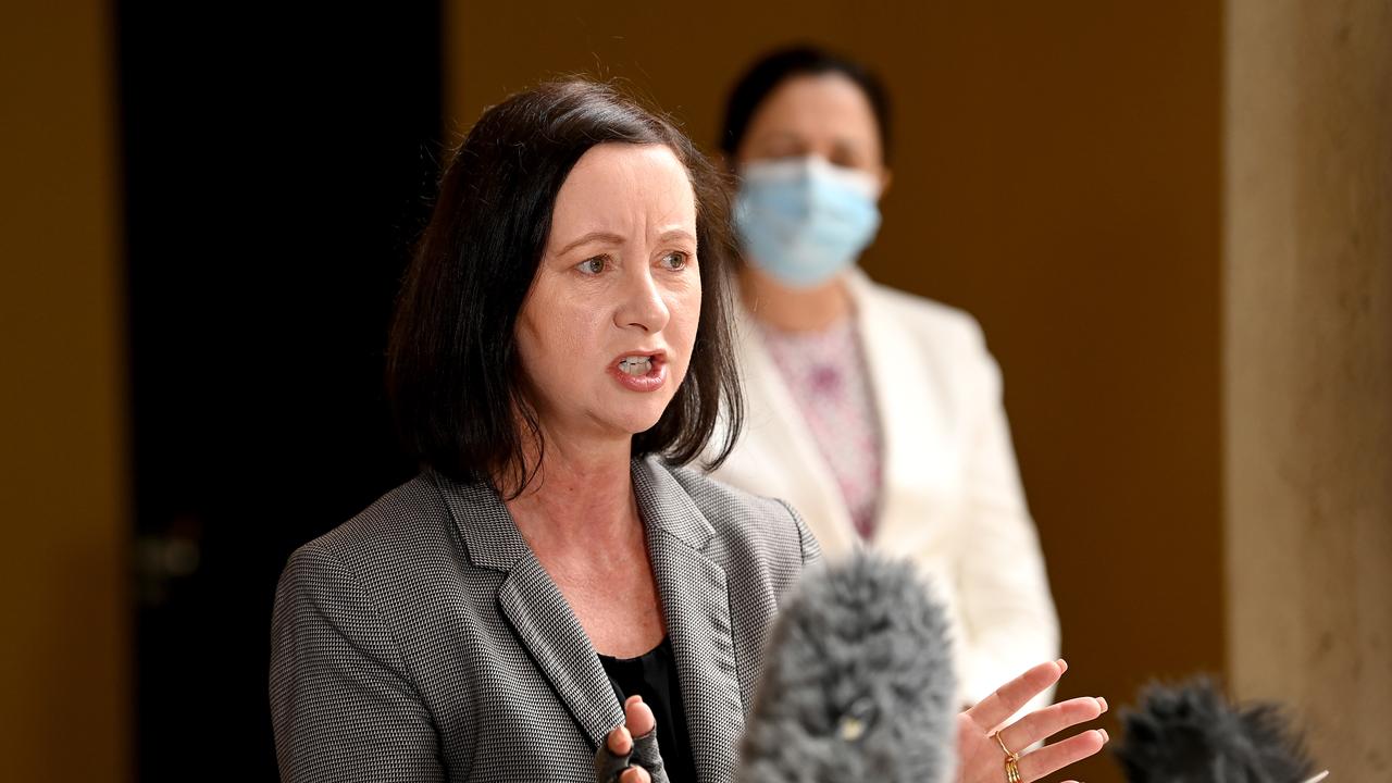 Queensland Health Minister Yvette D’Ath with Premier Annastacia Palaszczuk wearing a mask behind her. Photo: Bradley Kanaris/Getty Images.