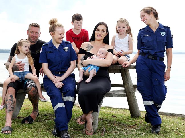 Baby Matty with his mum and dad Danielle and husband Matthew, their three other children Ace, 10, Alivia, 5, Kandace, 3; and paramedics Renee Oldfield (left) and Vivian Merz. Picture: Tim Hunter