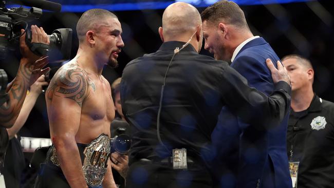 Michael Bisping confronts Robert Whittaker after the Aussie won the interim UFC middleweight title. Picture: Sam Ruttyn