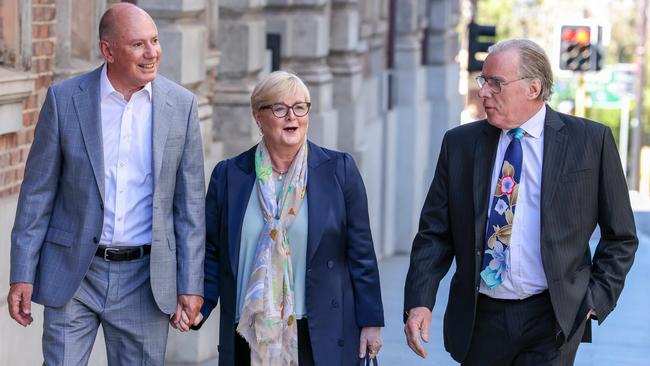 Linda Reynolds with her husband, left, and lawyer Martin Bennett. Picture: Colin Murty